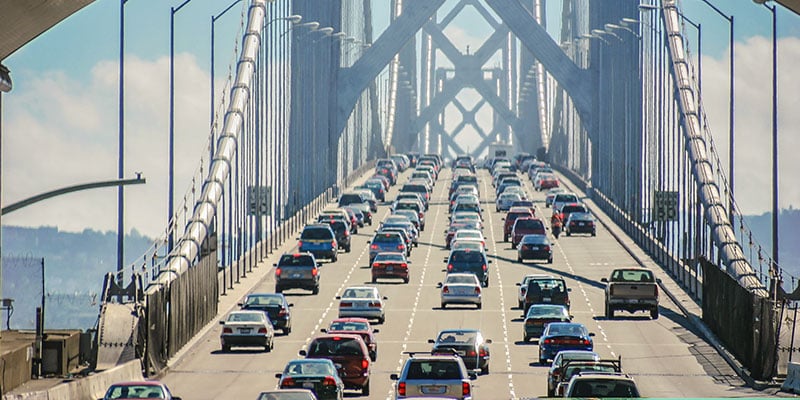 Cars driving over bridge on San Francisco bay 